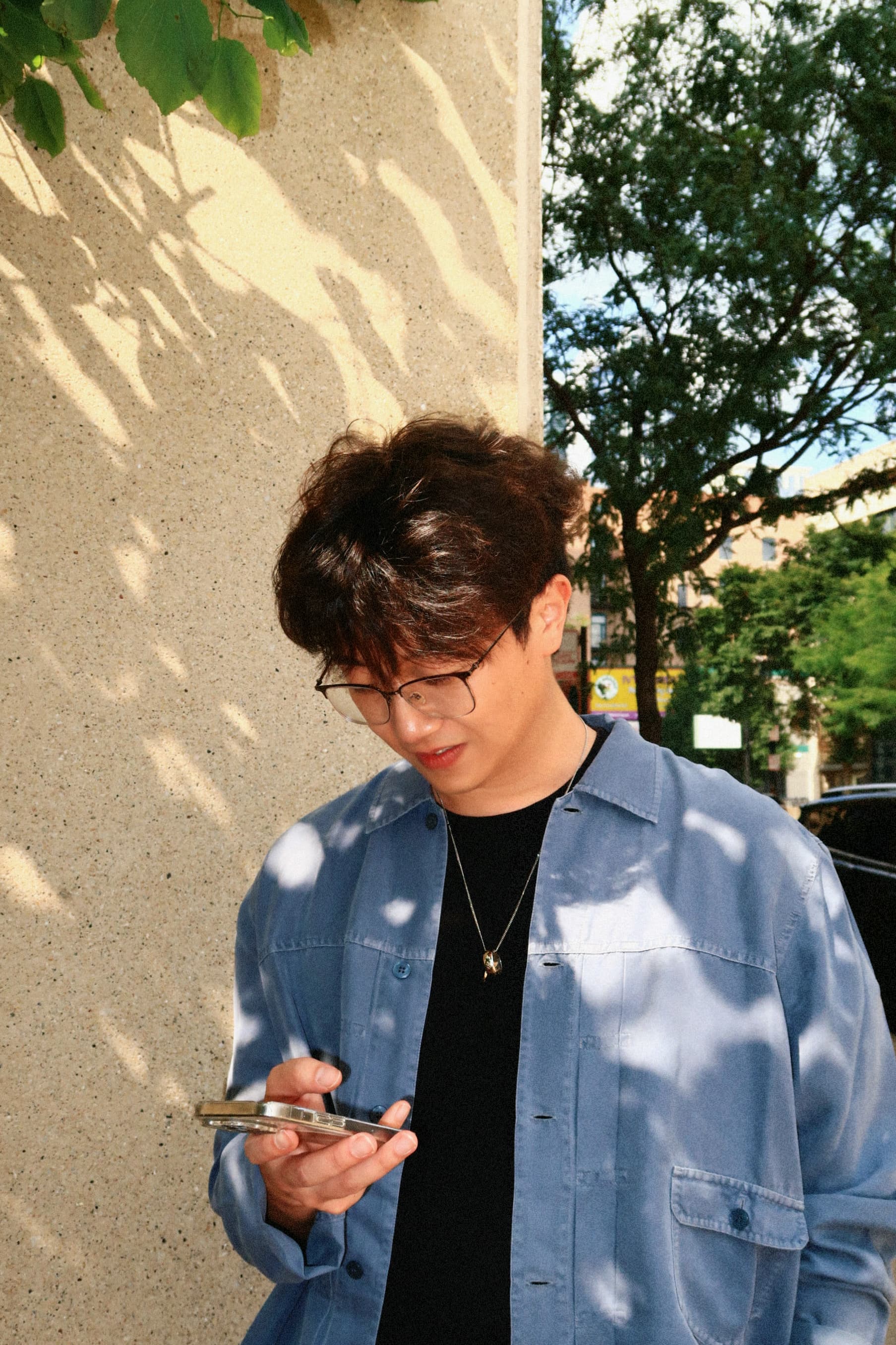 Candid portrait in patterned sunlight
